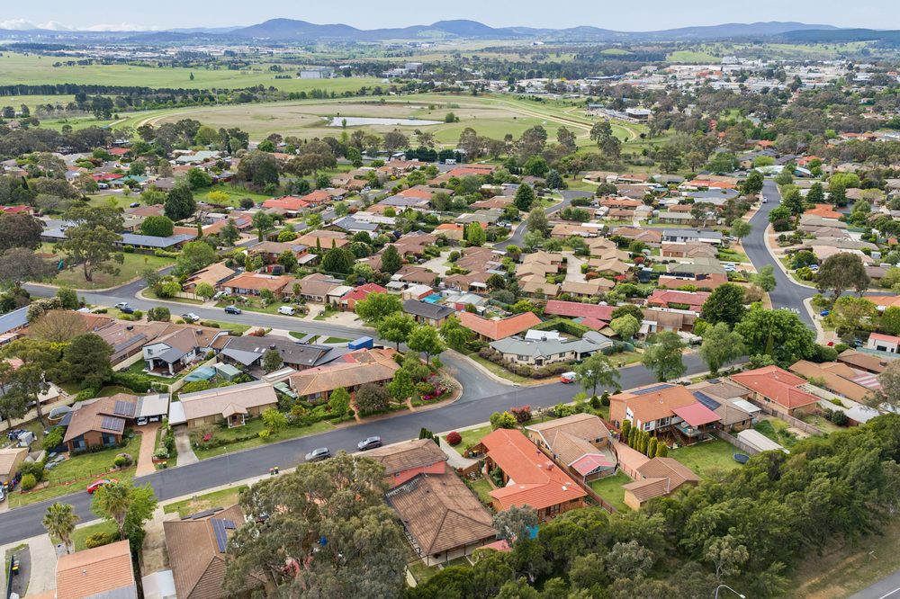 Aerial view across the suburb towards the hills