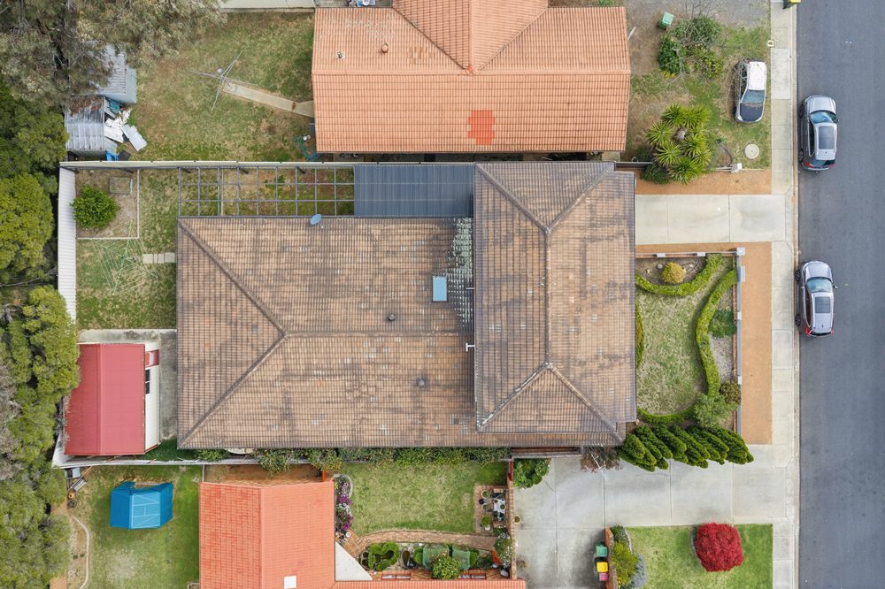 Aerial view straight down on the house, verandah, both garages and the yard