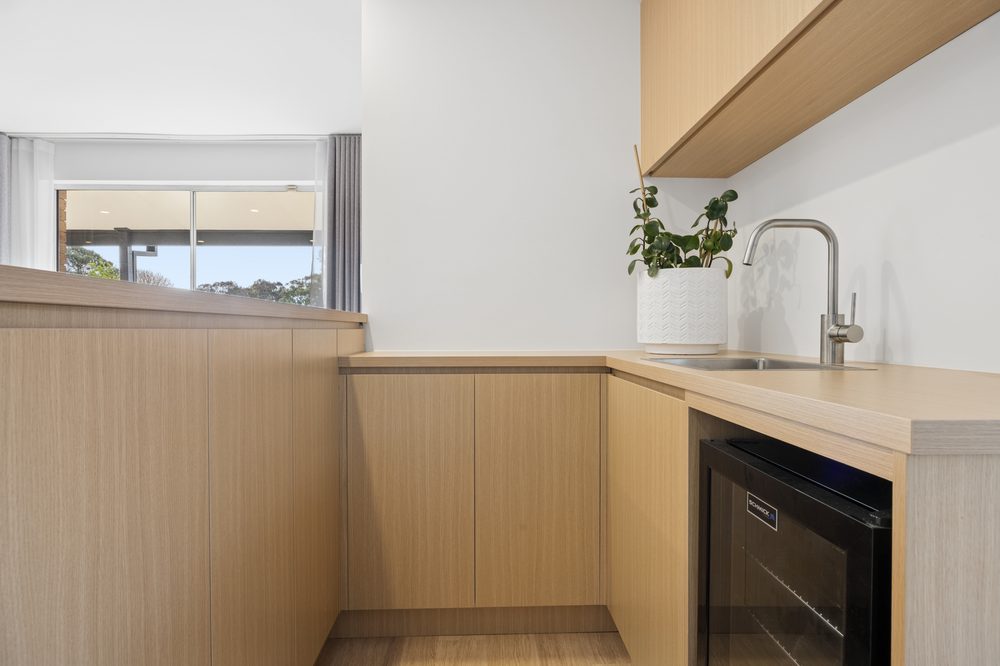 Built-in bar with sink and bar fridge